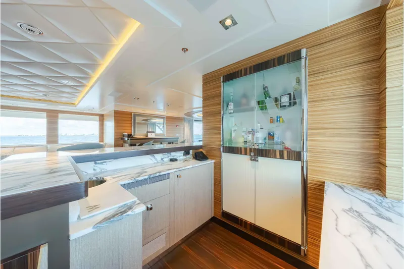 Slide: The Image of Luxurious interior of 2013 Feadship motor yacht with modern bar and elegant wood finishes. - 50