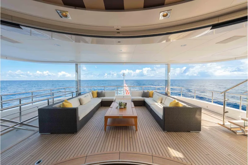 Slide: The Image of Luxurious 2013 Feadship motor yacht deck with ocean view and elegant seating area. - 52