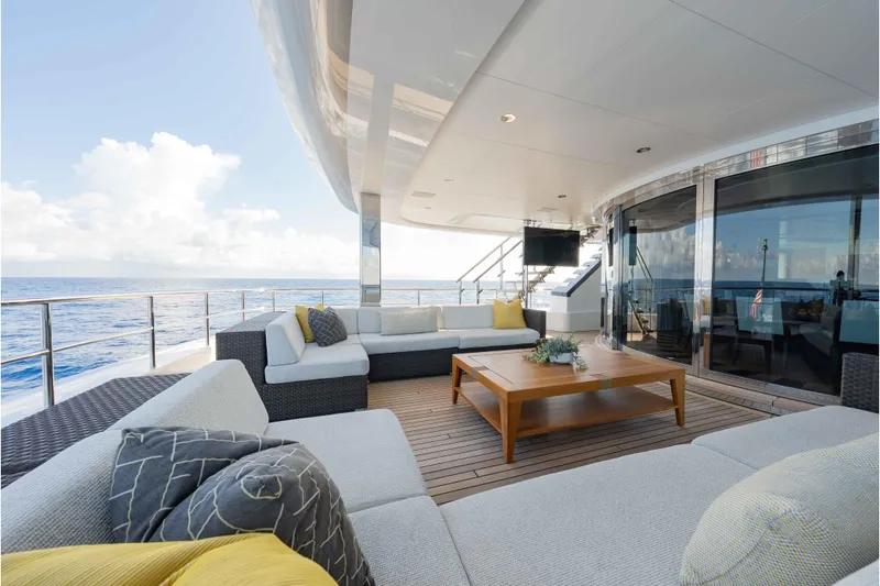 Slide: The Image of Luxurious 2013 Feadship motor yacht deck with elegant seating and ocean view. - 53