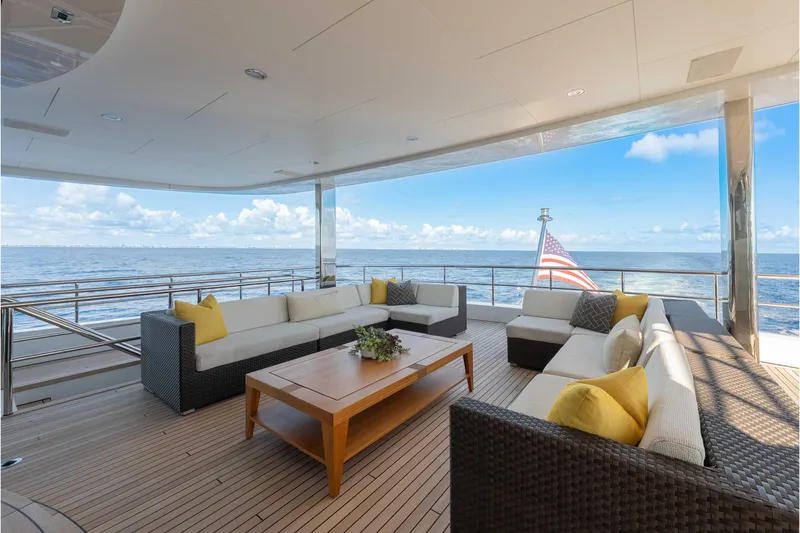 Slide: The Image of Luxurious 2013 Feadship motor yacht deck with elegant seating and ocean view. - 54