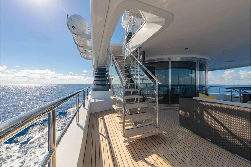 Slide: The Image of Luxurious 2013 Feadship motor yacht deck with ocean view and modern staircase. - 56