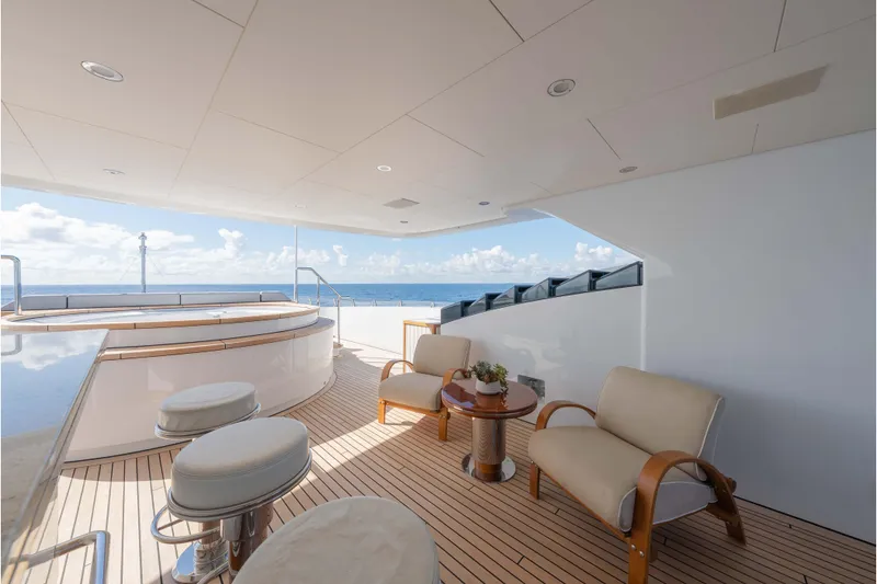 Slide: The Image of Luxurious 2013 Feadship motor yacht deck with seating, ocean view, and elegant design. - 58