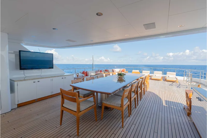Slide: The Image of Luxurious 2013 Feadship motor yacht deck with dining area and ocean view. - 62
