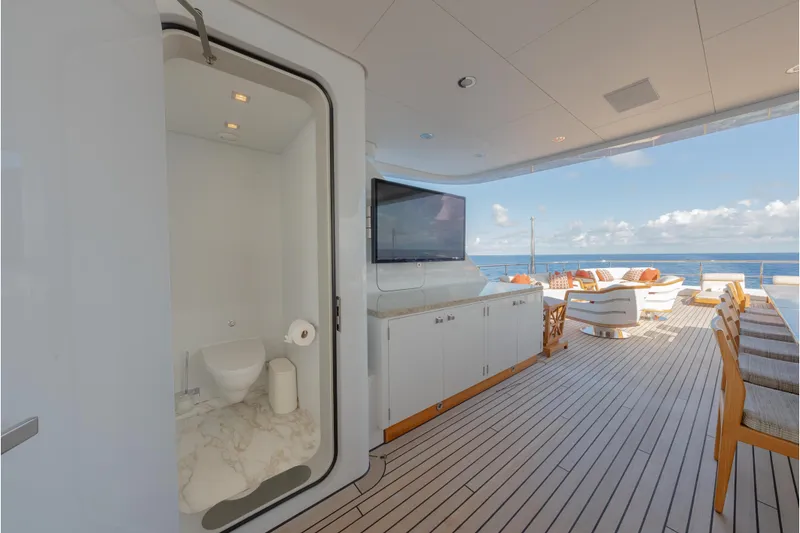 Slide: The Image of Luxurious 2013 Feadship motor yacht deck with seating, TV, and ocean view. - 64