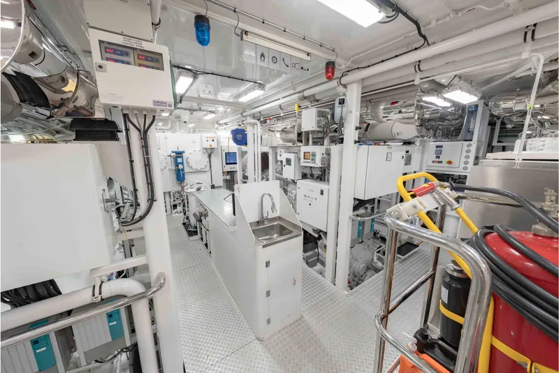 Slide: The Image of Engine room of 2013 Feadship Motor Yacht, featuring advanced machinery and control systems. - 75