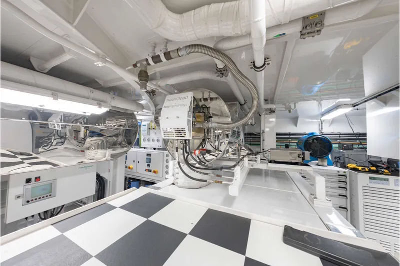 Slide: The Image of Engine room of a 2013 Feadship Motor Yacht, featuring advanced machinery and equipment. - 77