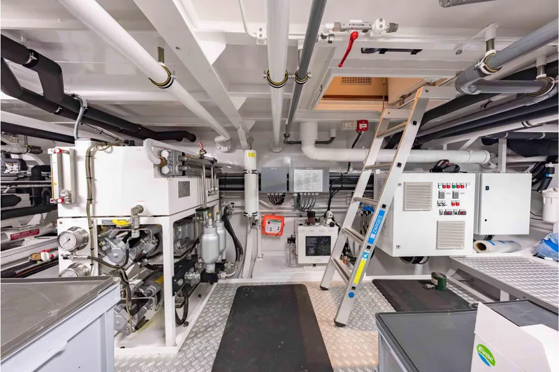 Slide: The Image of Engine room of 2013 Feadship Motor Yacht with machinery, pipes, and control panels. - 78