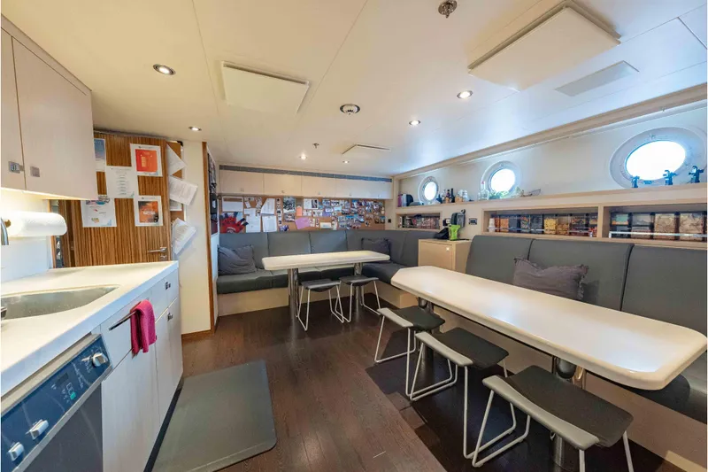 Slide: The Image of Luxurious 2013 Feadship motor yacht interior with modern dining area and kitchen. - 80