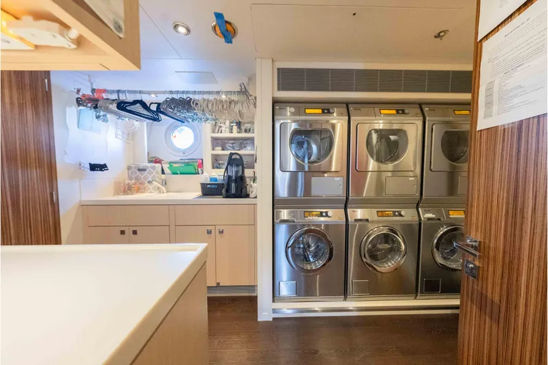 Slide: The Image of Laundry room on 2013 Feadship Motor Yacht with washers, dryers, and storage. - 82