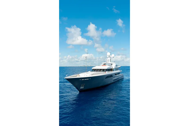Slide: The Image of Luxurious 2013 Feadship motor yacht cruising on open blue sea under clear sky. - 88