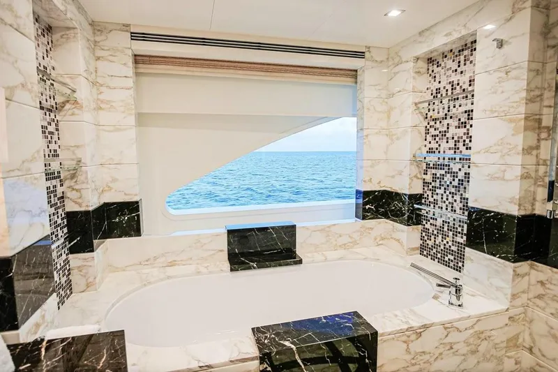 Slide: The Image of Luxurious interior of 2013 Feadship motor yacht with elegant seating and wooden flooring. - 9