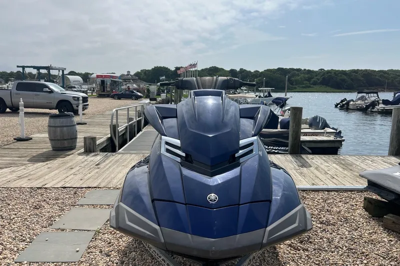 Slide: The Image of 2014 Yamaha WaveRunner FX Cruiser SVHO at a scenic marina dock. - 2