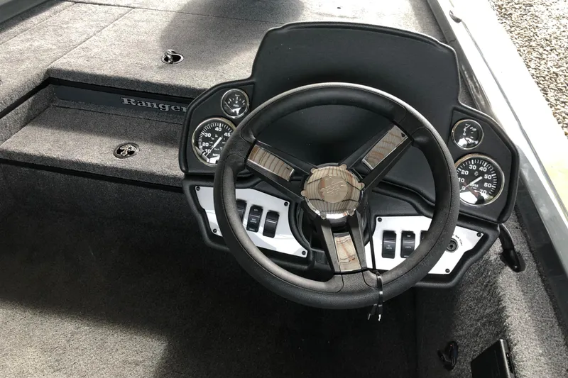 Slide: The Image of Steering console of 2026 Ranger RT178 boat with gauges and controls. - 13