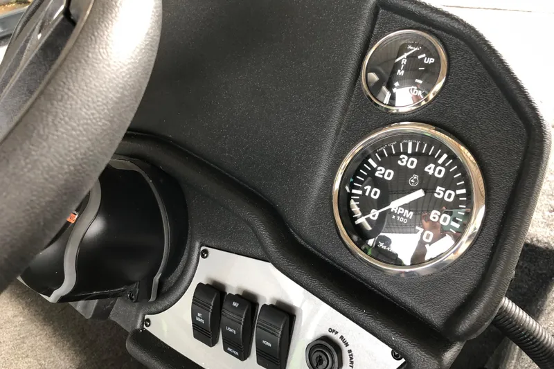 Slide: The Image of 2026 Ranger RT178 dashboard with RPM gauge and control switches. - 14