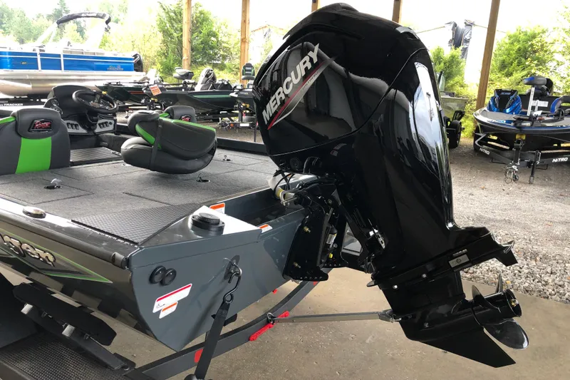 Slide: The Image of 2026 Ranger RT178 boat with Mercury outboard motor, parked in a covered area. - 4