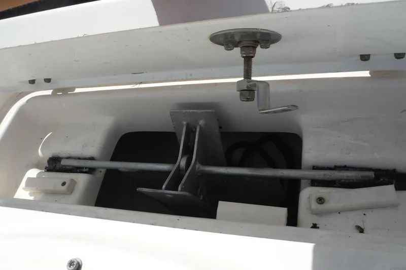 Slide: The Image of 2007 Robalo R227 Dual Console boat compartment with metal latch mechanism. - 16