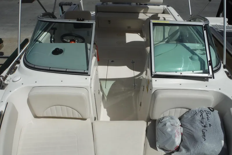 Slide: The Image of 2007 Robalo R227 Dual Console boat interior with open windshield and seating. - 17