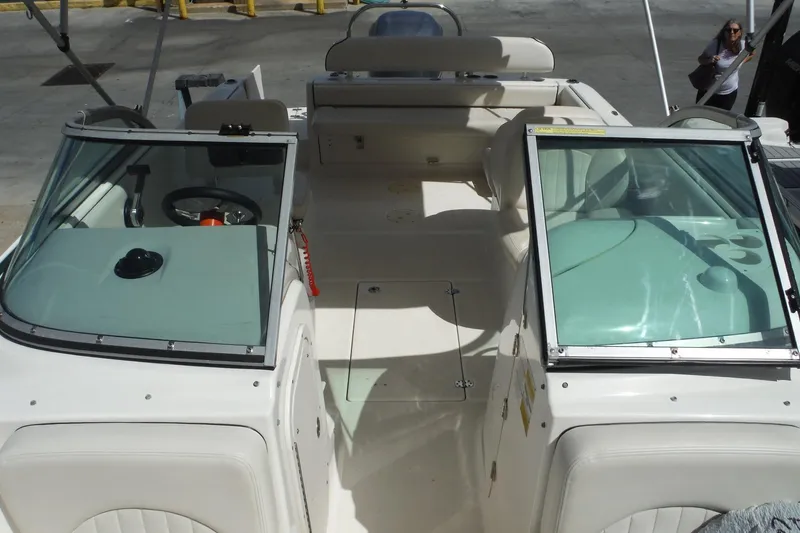 Slide: The Image of 2007 Robalo R227 Dual Console boat interior with seating and steering wheel. - 19