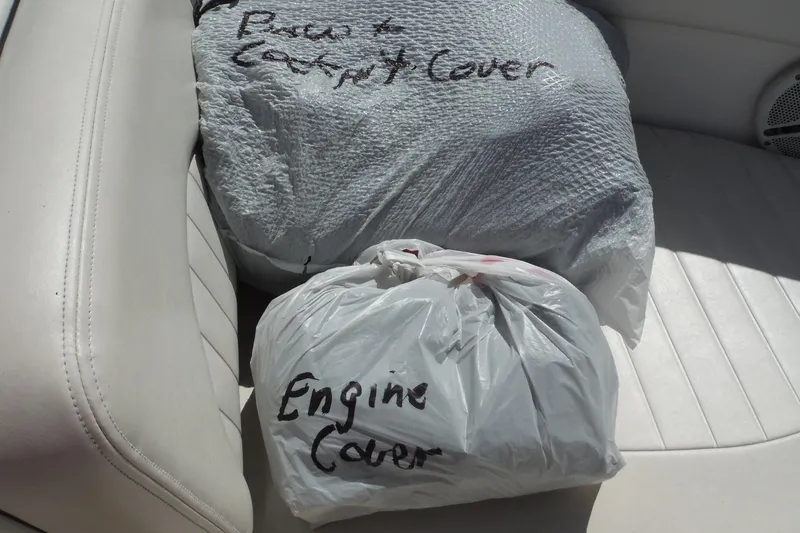 Slide: The Image of Boat seat with labeled covers for engine and cockpit on Robalo R227. - 20