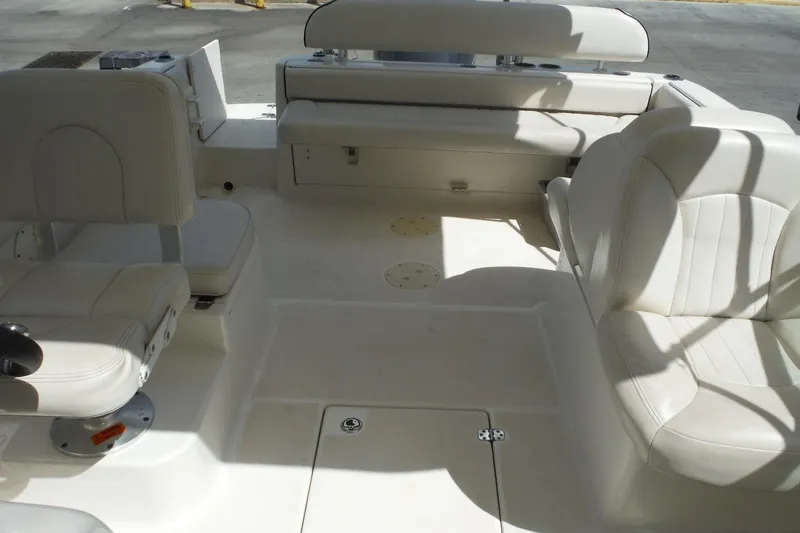 Slide: The Image of 2007 Robalo R227 Dual Console boat interior with white seating and spacious layout. - 21