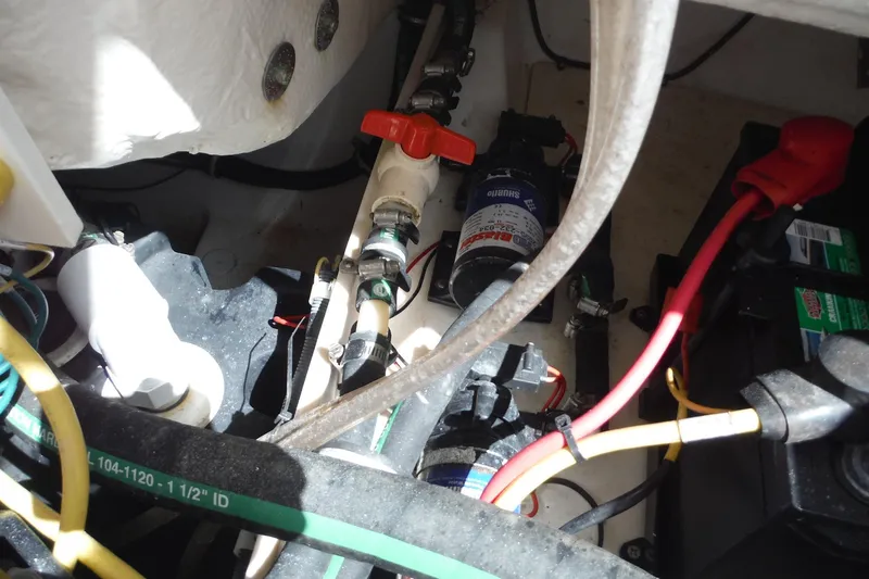 Slide: The Image of 2007 Robalo R227 Dual Console boat engine compartment with wiring and components. - 23