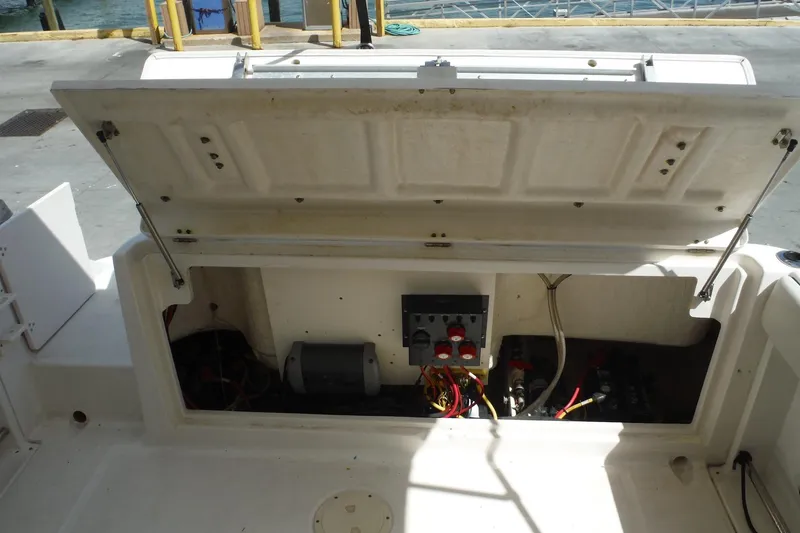 Slide: The Image of 2007 Robalo R227 Dual Console boat storage compartment with wiring and equipment. - 25