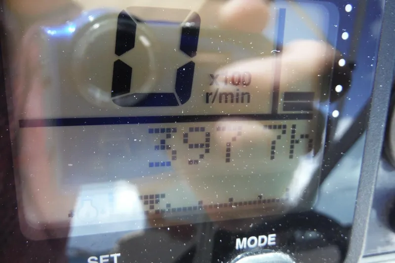 Slide: The Image of Close-up of a 2007 Robalo R227 Dual Console boat's digital display showing RPM and settings. - 26