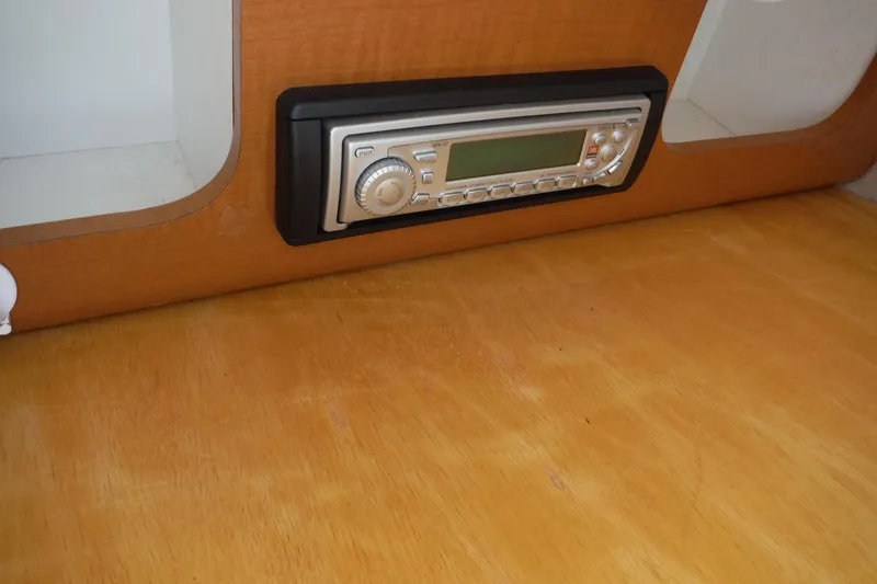 Slide: The Image of 2007 Robalo R227 Dual Console boat interior with built-in stereo system. - 28