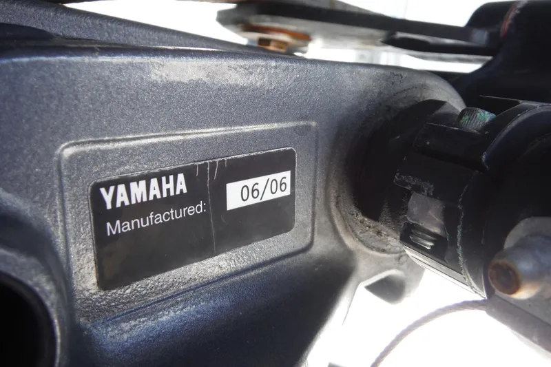 Slide: The Image of Yamaha engine label showing manufacture date 06/06 on a 2007 Robalo R227 Dual Console. - 35
