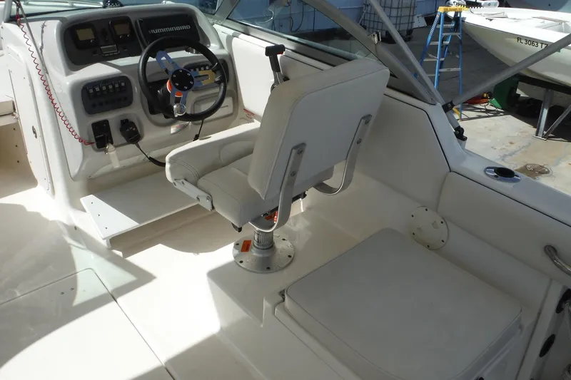 Slide: The Image of 2007 Robalo R227 Dual Console boat interior with steering wheel and seating. - 7
