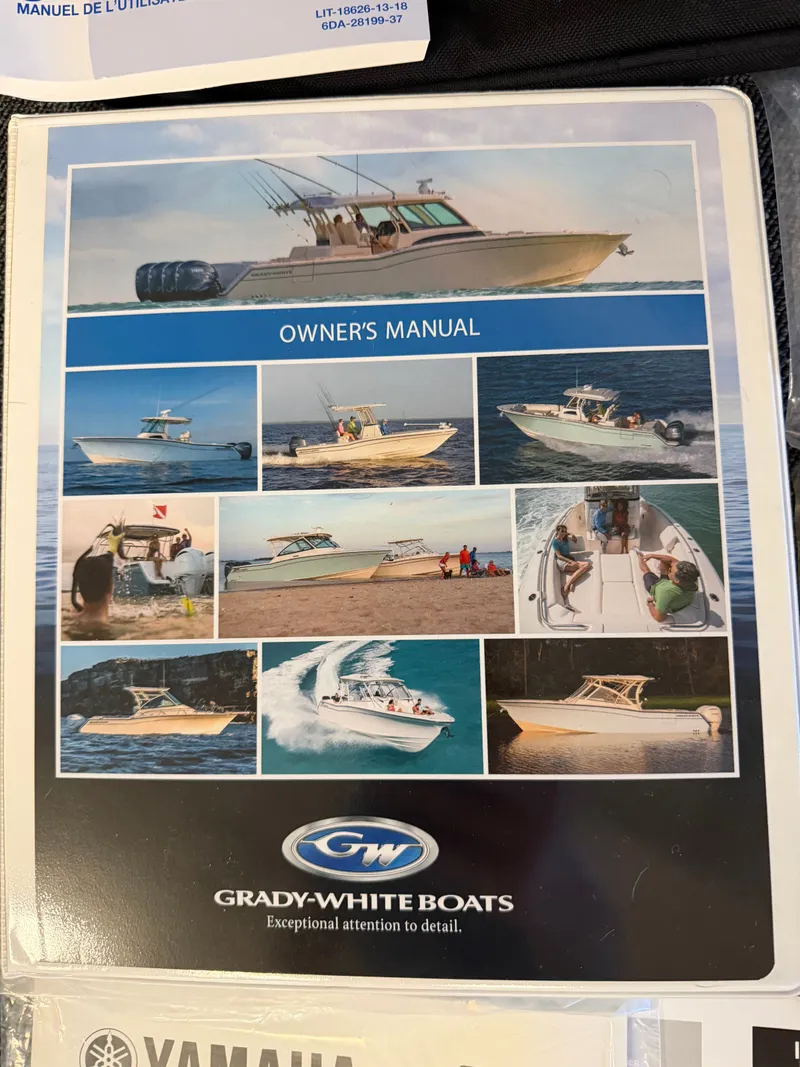 Slide: The Image of Grady-White Freedom 215 2023 owner's manual with boat images on water. - 15
