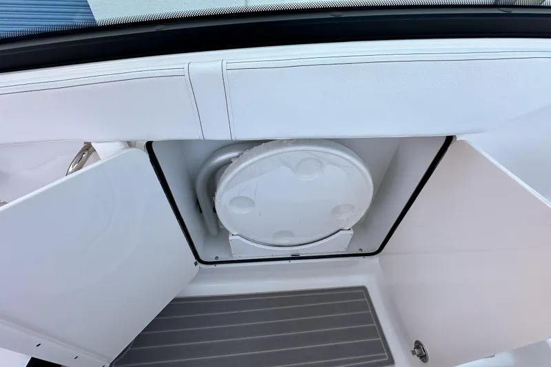 Slide: The Image of 2026 Sea Ray Sundancer 320 boat interior with sleek white design and modern features. - 21