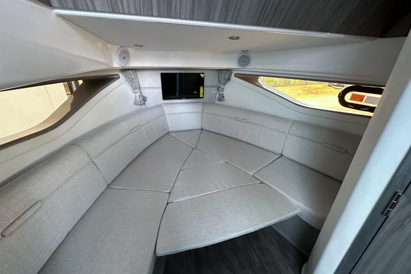 Slide: The Image of Electrical panel inside 2026 Sea Ray Sundancer 320 yacht, featuring switches and safety labels. - 25