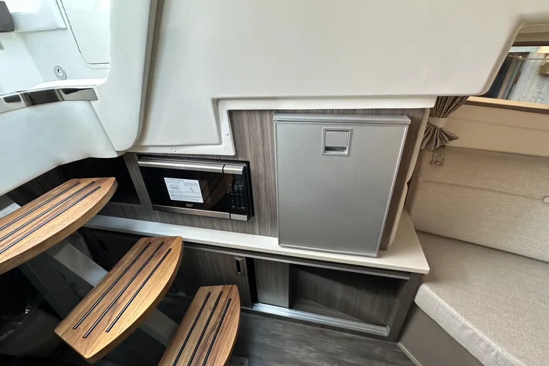 Slide: The Image of 2026 Sea Ray Sundancer 320 interior bathroom with modern fixtures and compact design. - 29