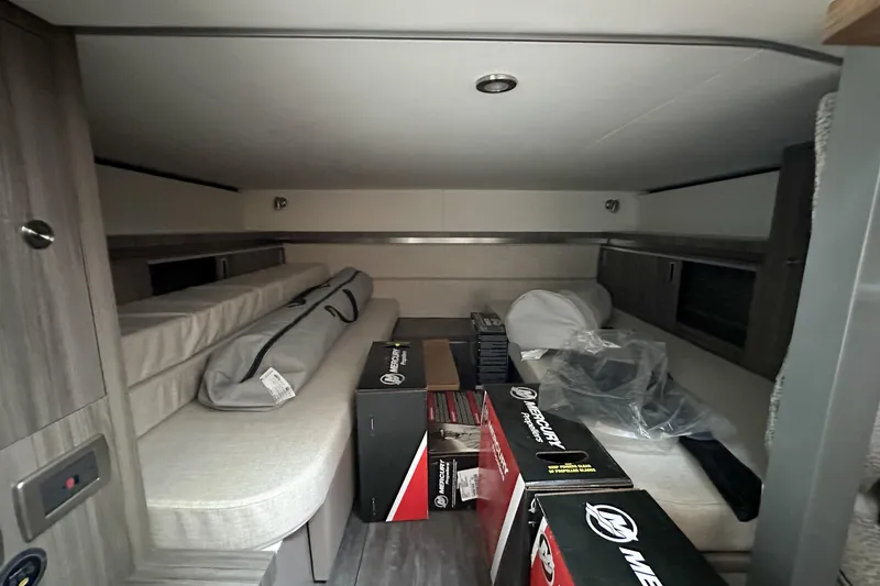 Slide: The Image of 2026 Sea Ray Sundancer 320 with luxurious white seating and modern design. - 34