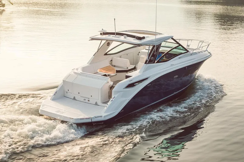 Slide: The Image of Manufacturer Provided Image: Aerial view of 2025 Sea Ray Sundancer 320 cruising on turquoise water. - 46