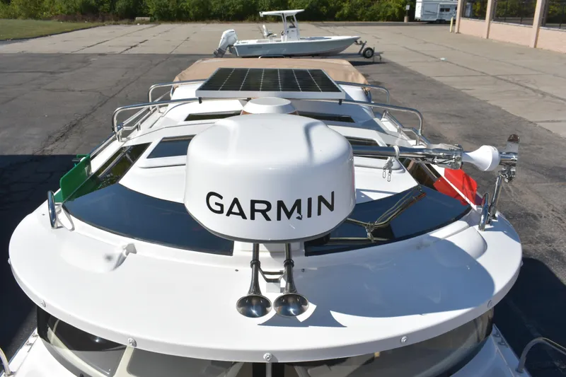 Slide: The Image of 2024 Ranger Tugs R-27 boat with Garmin radar and solar panels on deck. - 13