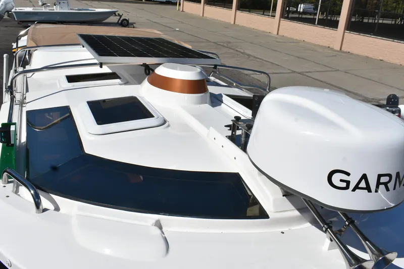 Slide: The Image of 2024 Ranger Tugs R-27 boat with solar panel and Garmin equipment on deck. - 14