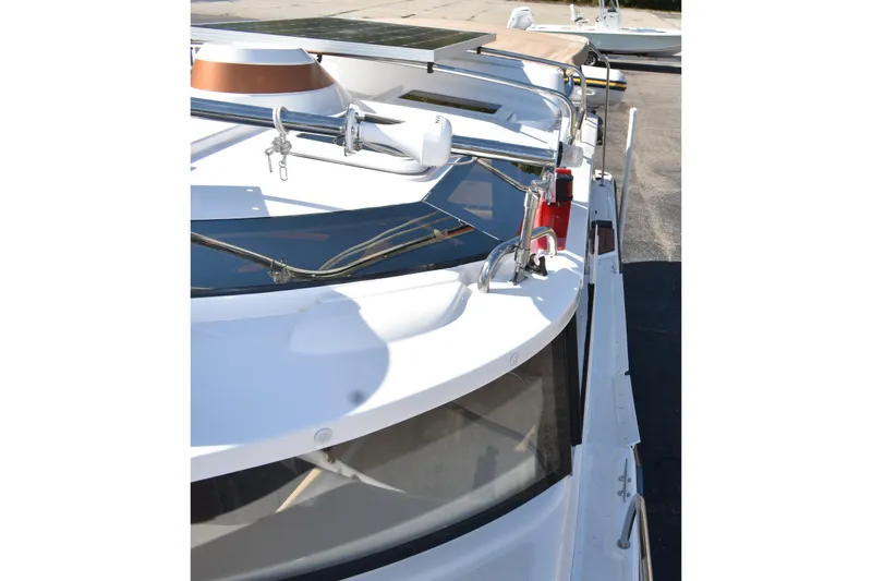 Slide: The Image of 2024 Ranger Tugs R-27 boat deck with solar panel and railing details. - 15
