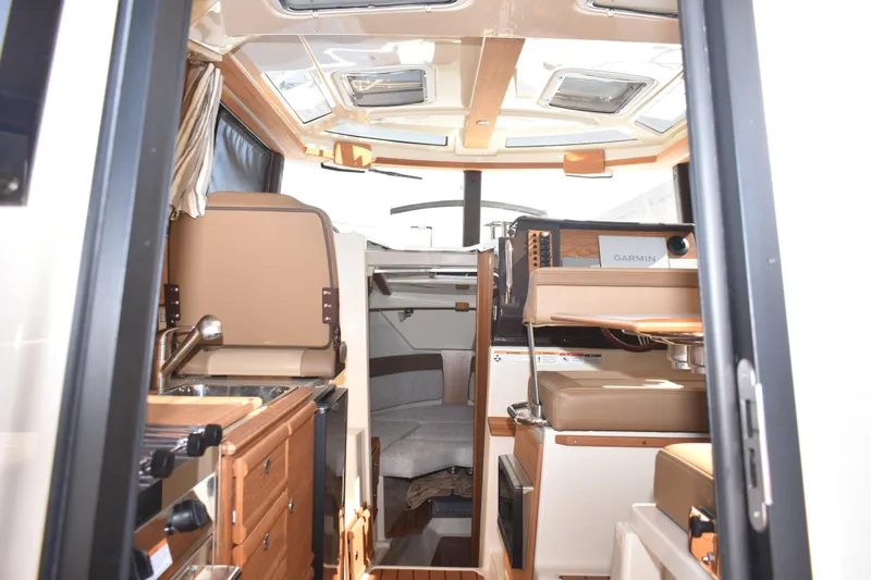 Slide: The Image of Interior of 2024 Ranger Tugs R-27 boat, featuring modern design and comfortable seating. - 32