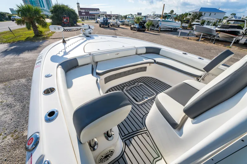 Slide: The Image of 2020 Tidewater 2500 Carolina Bay boat interior with seating and deck details. - 13
