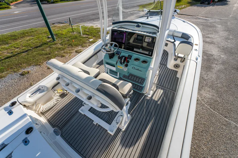 Slide: The Image of 2020 Tidewater 2500 Carolina Bay boat interior with helm and seating area. - 15