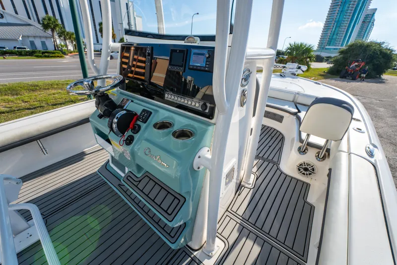 Slide: The Image of 2020 Tidewater 2500 Carolina Bay boat interior with modern console and seating. - 20