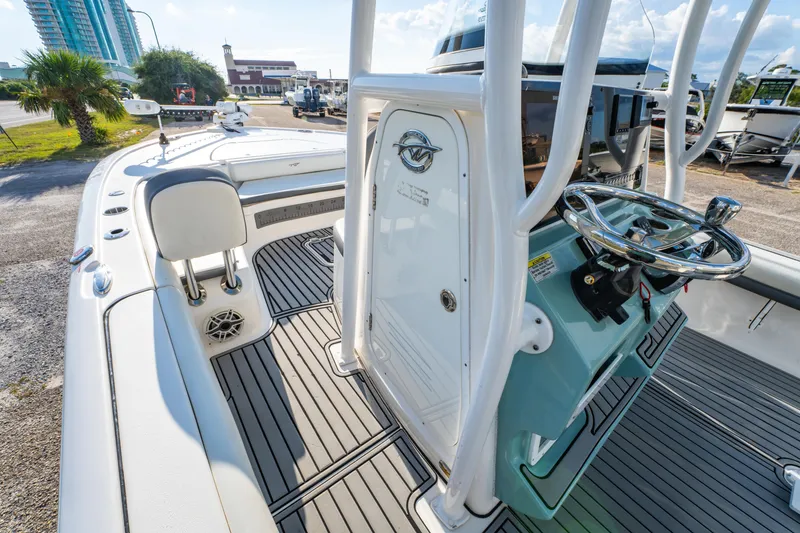 Slide: The Image of 2020 Tidewater 2500 Carolina Bay boat interior with steering console and seating. - 25
