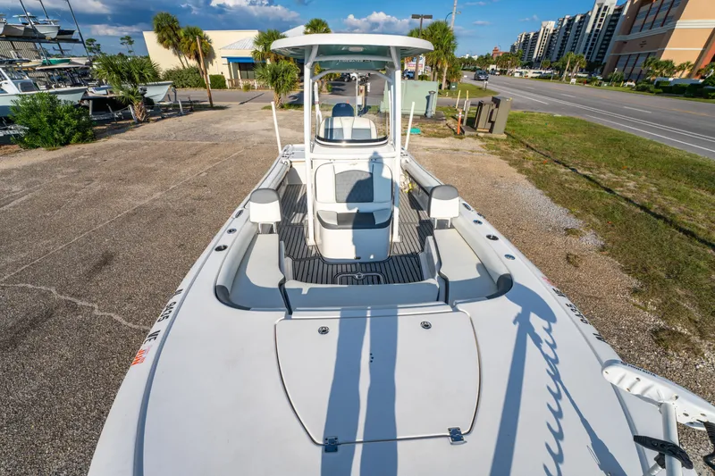 Slide: The Image of 2020 Tidewater 2500 Carolina Bay boat parked on a sunny day near a road. - 27
