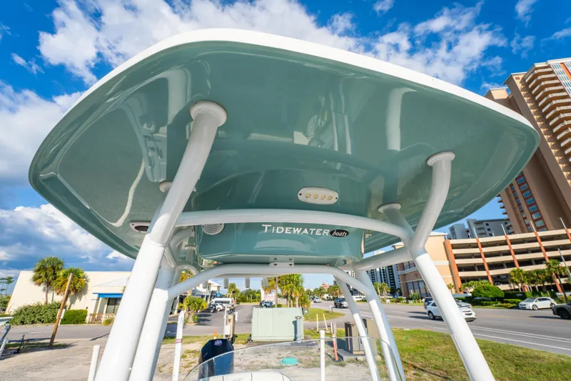 Slide: The Image of Battery compartment of 2020 Tidewater 2500 Carolina Bay boat with wiring and components. - 28