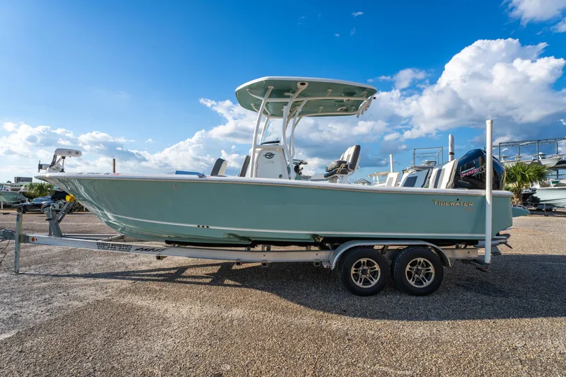 Slide: The Image of 2020 Tidewater 2500 Carolina Bay boat on trailer under blue sky. - 8