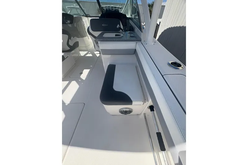 Slide: The Image of 2021 Robalo R317 Dual Console interior with seating and console details. - 13
