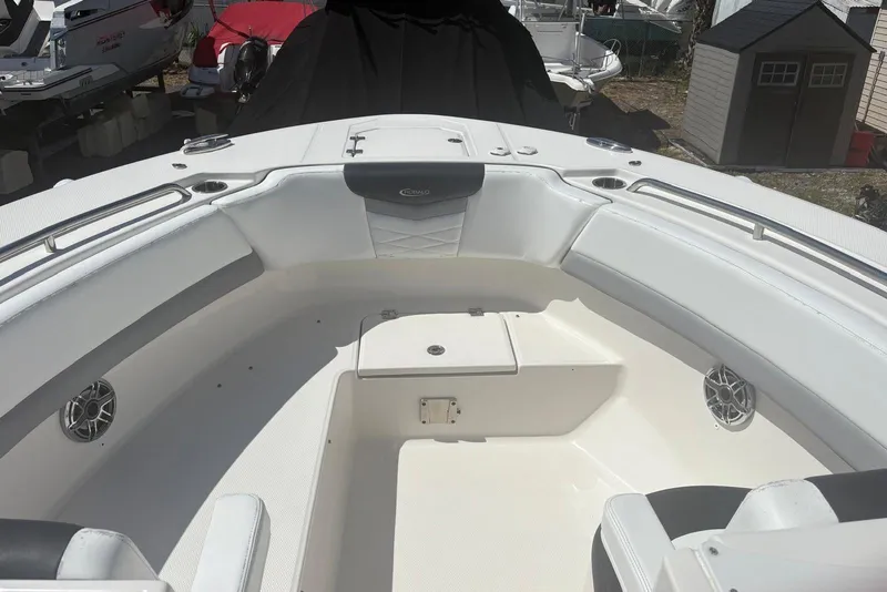 Slide: The Image of 2021 Robalo R317 Dual Console boat interior with white seating and stainless steel accents. - 15