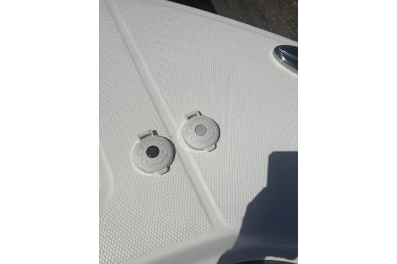 Slide: The Image of 2021 Robalo R317 Dual Console deck with two circular fittings. - 20